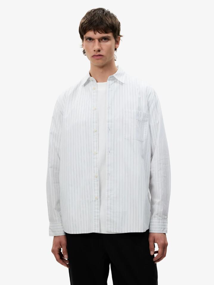 Image of a model wearing Tops. Productname: Article One Martin Poplin Shirt in Navy White colour by brand - Article One