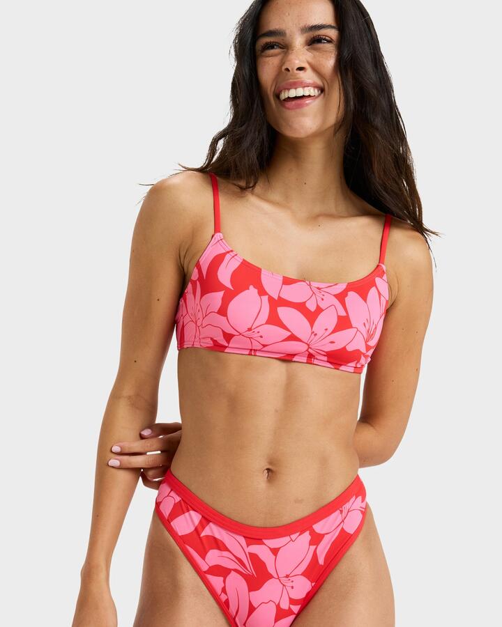 Image of a model wearing Tops. Product name - Roxy Womens Khloe Basic Bralette Bikini Top Tomato Klaeido in Tomato Klaeido colour by brand - Roxy