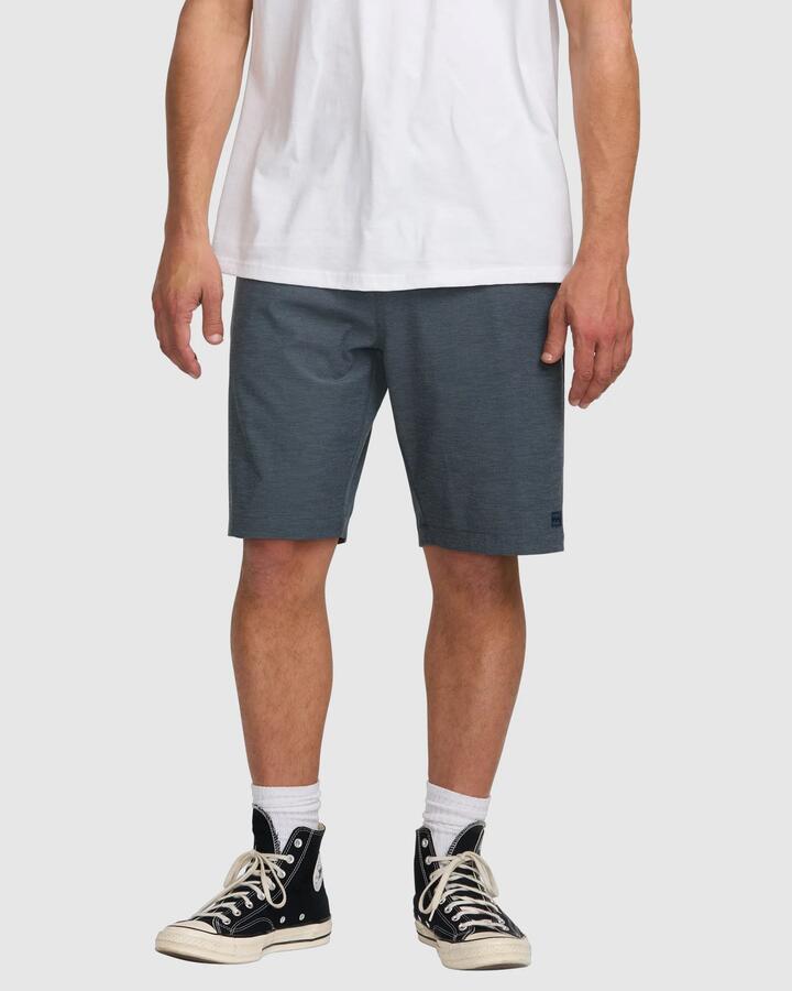 Image of a model wearing Shorts. Product name - Billabong Mens Crossfire 21" Hybrid Shorts Navy - in Navy colour by brand - Billabong
