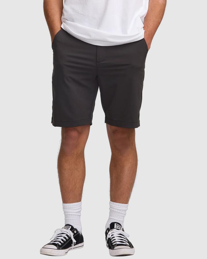 Image of a model wearing Shorts. Product name - Billabong Mens Surftek 20" Hybrid Shorts Black in Black colour by brand - Billabong