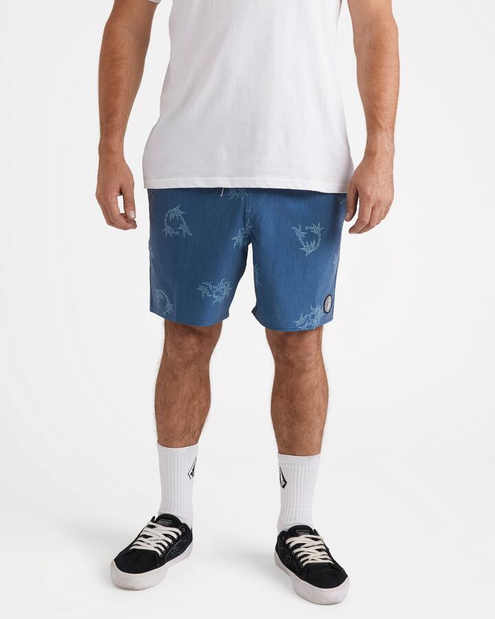 Image of a model wearing Shorts. Product name - Volcom Mens Regal Trop Psych Cotton 17" Swim Shorts Coronet Blue in Coronet Blue colour by brand - Volcom