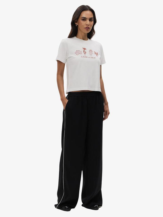 Image of a model wearing Pants. Productname: Lulu & Rose Tori Contrast Pant in Black-Crm colour by brand - Lulu & Rose