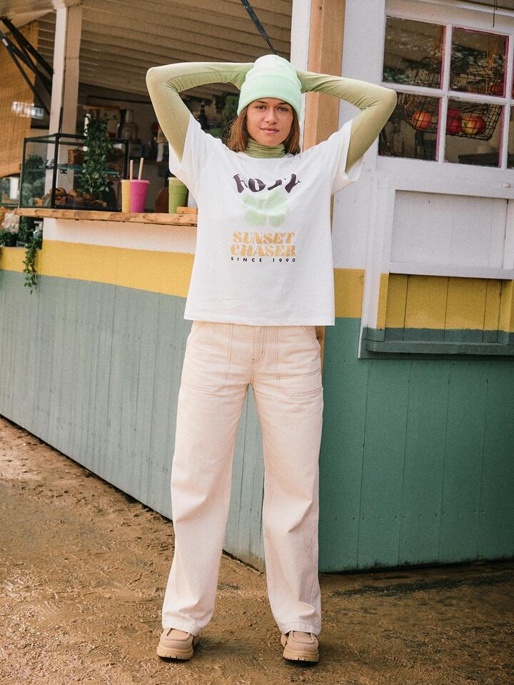 Image of a model wearing Pants. Product name - Roxy Womens Vibrant Air Pants Parchment in Parchment colour by brand - Roxy