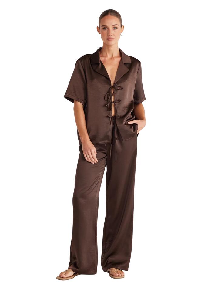 Image of a model wearing Pants. Productname: SNDYS Dove Pant 2.0 in Chocolate colour by brand - SNDYS