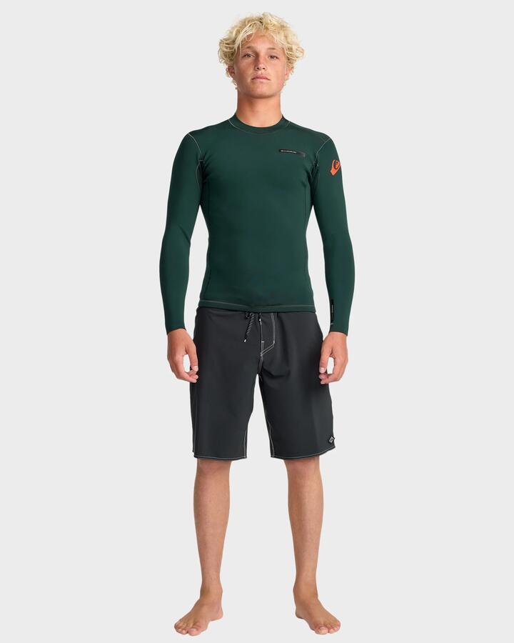 Image of a model wearing Tops. Product name - Quiksilver Mens 1.5Mm Esession Long Sleeve Wetsuit Top Jade in Jade colour by brand - Quiksilver