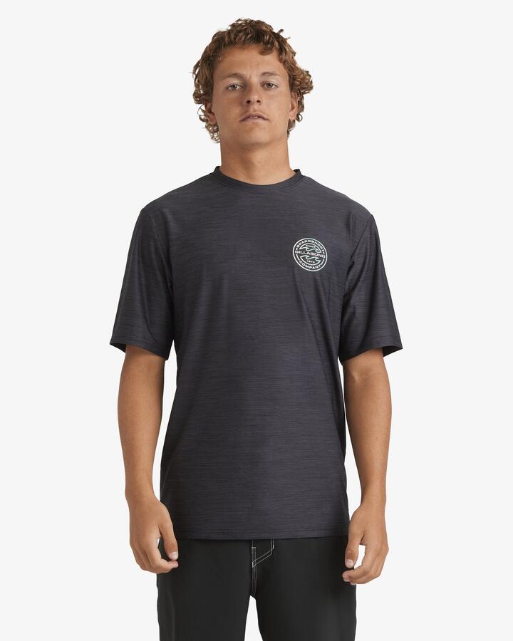 Image of a model wearing Tops. Product name - Billabong Mens Rotor Shoreline Short Sleeve Rash Vest Black Heather in Black Heather colour by brand - Billabong