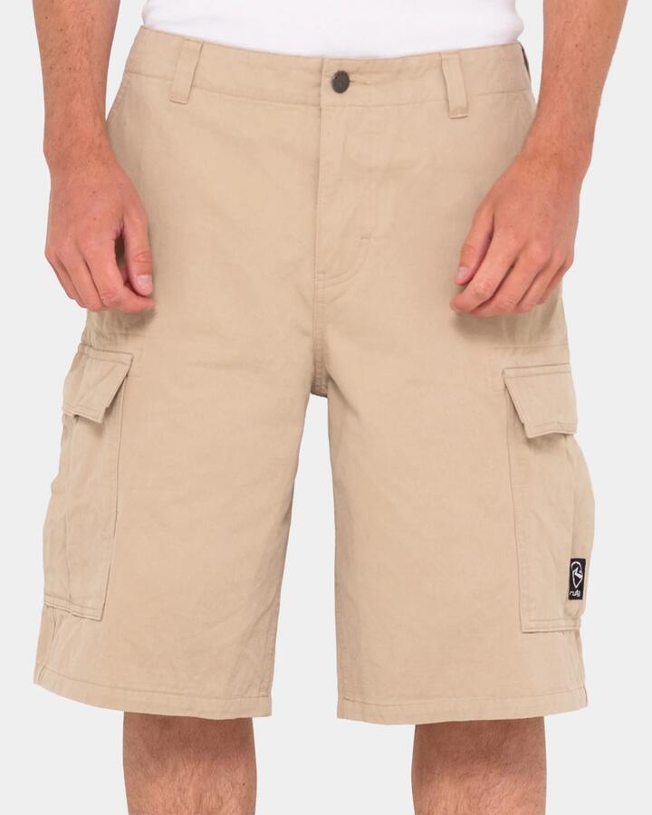 Image of a model wearing Shorts. Productname: Rusty - Mens Commando Cargo Shorts - Stone - in Stone colour by brand - Rusty