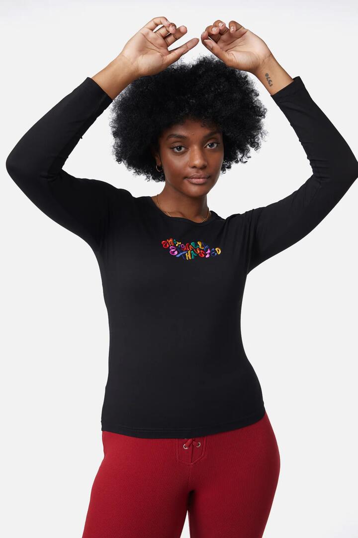 Image of a model wearing Tops. Product name - Emrboidered Emotions Top in Black colour by brand - Dangerfield