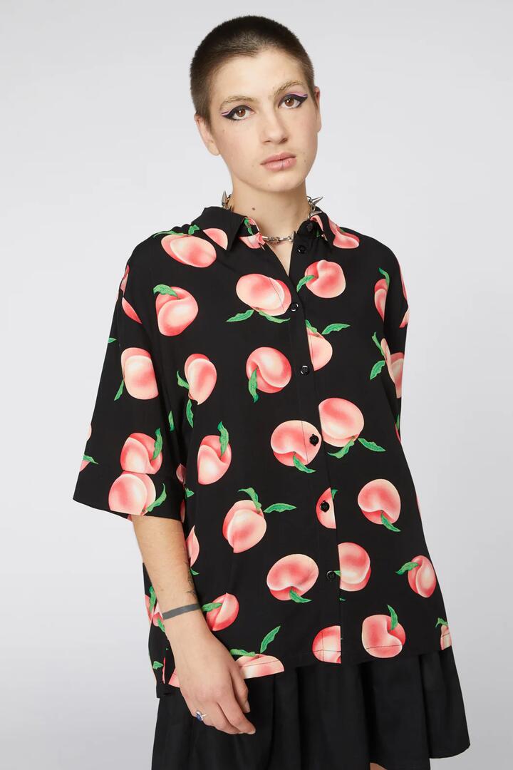 Image of a model wearing Tops. Productname: Peachy Viscose Boxy Shirt in Black colour by brand - Dangerfield