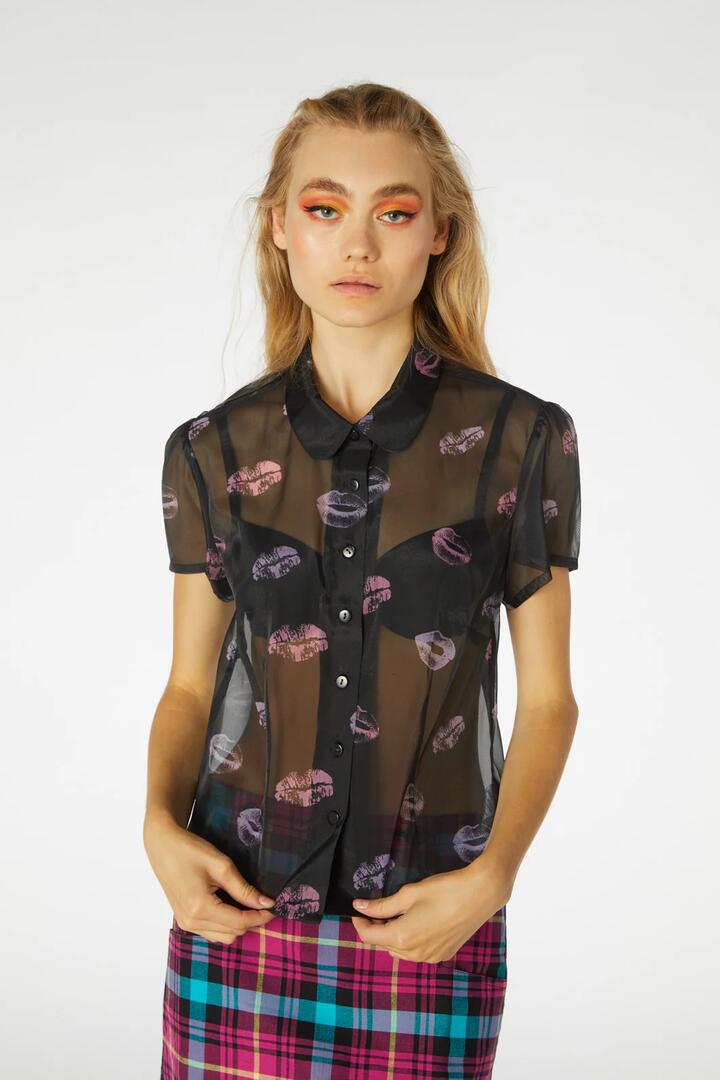 Image of a model wearing Tops. Productname: Glow Getter Blouse in Black colour by brand - Revival