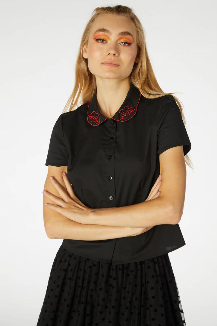 Image of a model wearing Tops. Productname: Stunning Beauty Blouse in Black colour by brand - Revival
