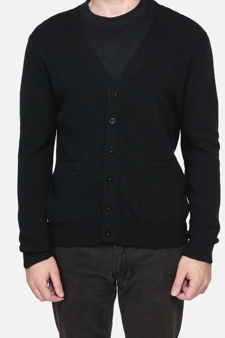 Image of a model wearing Outerwear. Productname: Pistolero Cardi in Black colour by brand - Revival