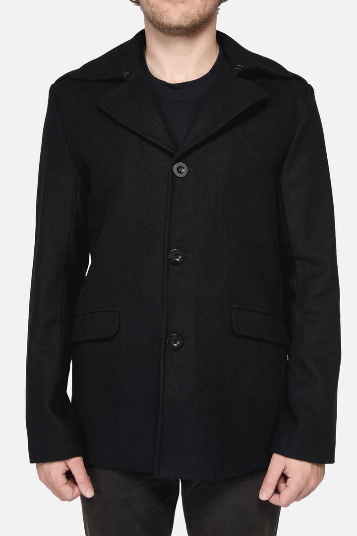 Image of a model wearing Outerwear. Productname: Bruno Coat in Black colour by brand - Revival