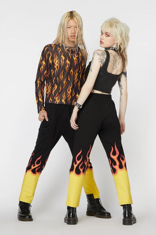 Image of a model wearing Pants. Productname: Flame Border Track Pant in Black colour by brand - Dangerfield