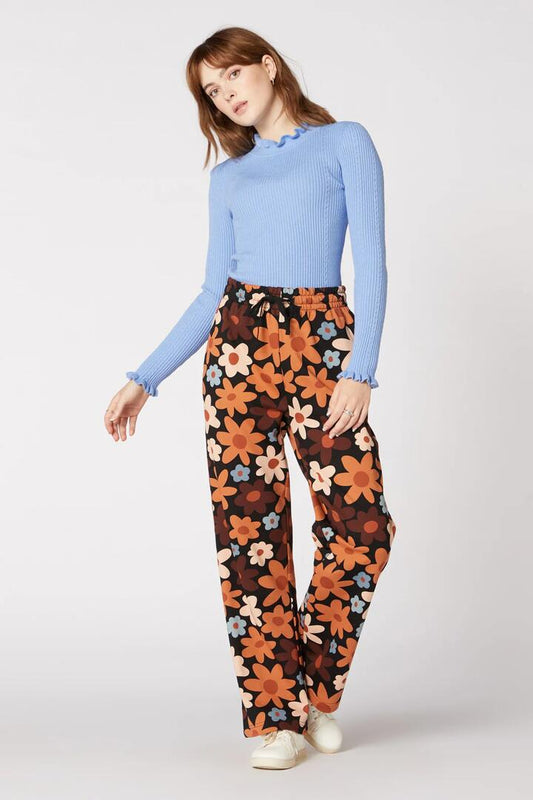 Image of a model wearing Pants. Productname: 60S Daisy Floral Straight Leg Pant in Black colour by brand - Princess Highway