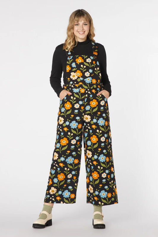 Image of a model wearing Pants. Productname: Ingrid Floral Overall in Black colour by brand - Princess Highway