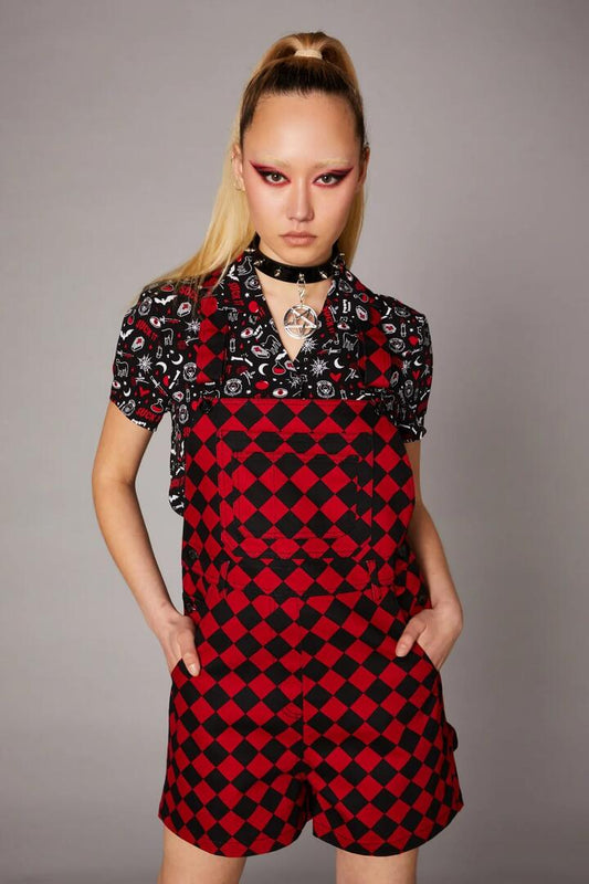 Image of a model wearing Pants. Productname: Checkmate Goth Overall in Black/Red colour by brand - Black Friday