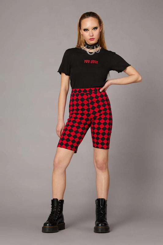Image of a model wearing Shorts. Productname: Checkmate Goth Bike Short in Red/Black colour by brand - Black Friday