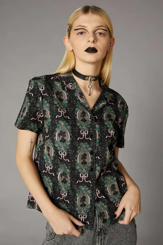 Image of a model wearing Tops. Productname: Spooky Cameo Print Blouse in Black colour by brand - Black Friday