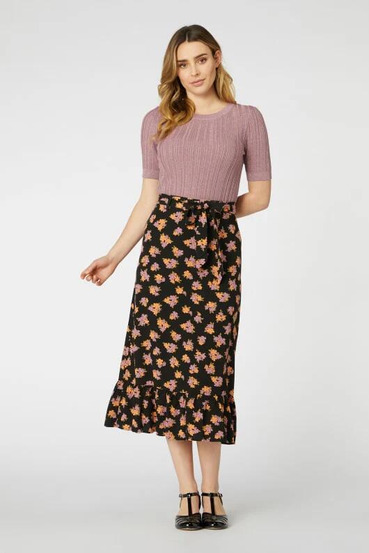 Image of a model wearing Skirts. Productname: Ida Ditsy Midi Skirt in Black colour by brand - Princess Highway