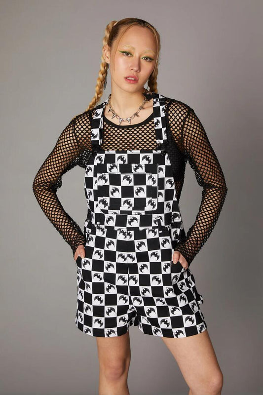 Image of a model wearing Pants. Productname: Bat Check Print Goth Overall in Black/White colour by brand - Black Friday