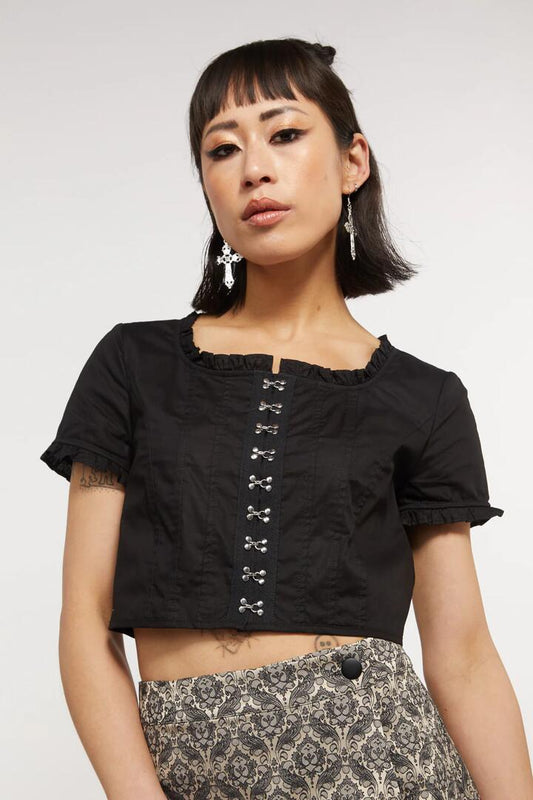 Image of a model wearing Tops. Productname: Gothic Secrets Crop Blouse in Black colour by brand - Dangerfield