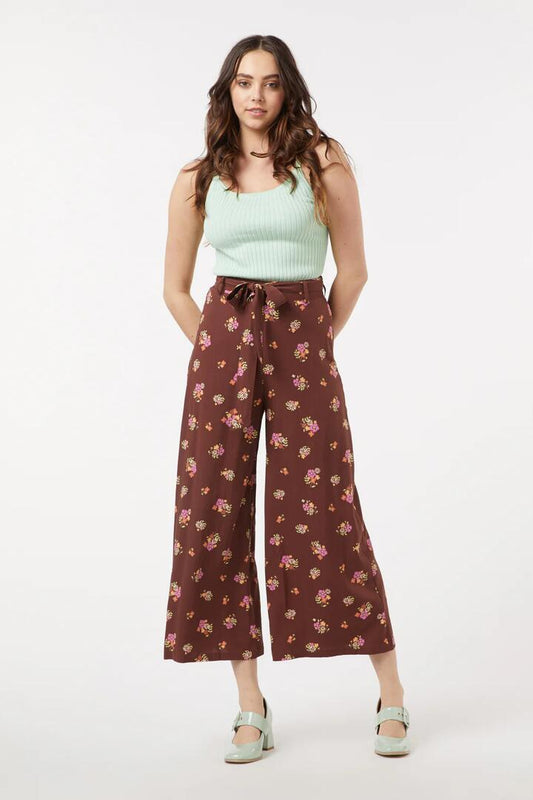 Image of a model wearing Pants. Productname: Ziva Floral Pant in Chocolate colour by brand - Princess Highway