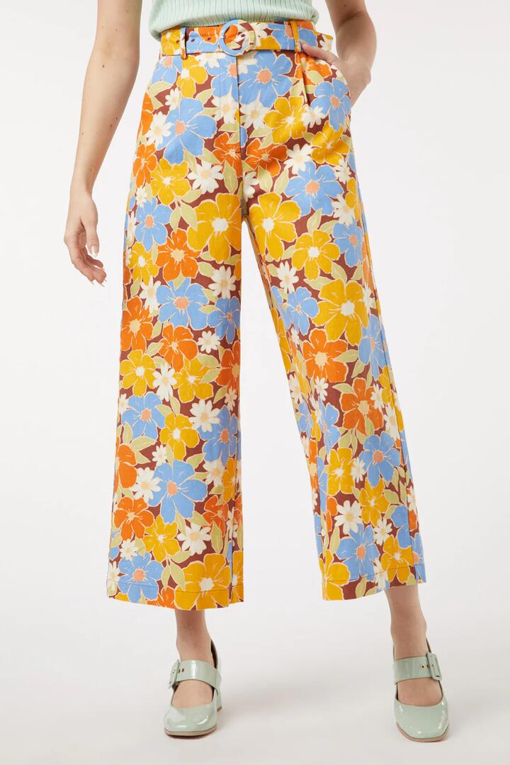 Image of a model wearing Pants. Productname: Edie Floral Pant in Gold colour by brand - Princess Highway