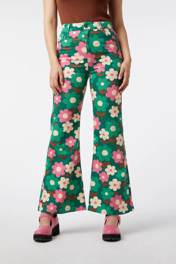 Image of a model wearing Denim. Productname: Renee Floral Flare Jean in Green colour by brand - Princess Highway