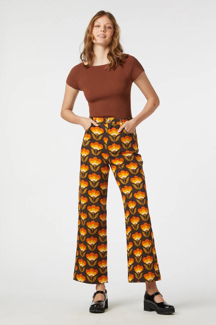 Image of a model wearing Denim. Productname: 70S Wallpaper Jean in Gold colour by brand - Princess Highway