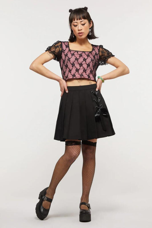 Image of a model wearing Skirts. Productname: Satine Lacing Pleated Skirt in Black colour by brand - Dangerfield