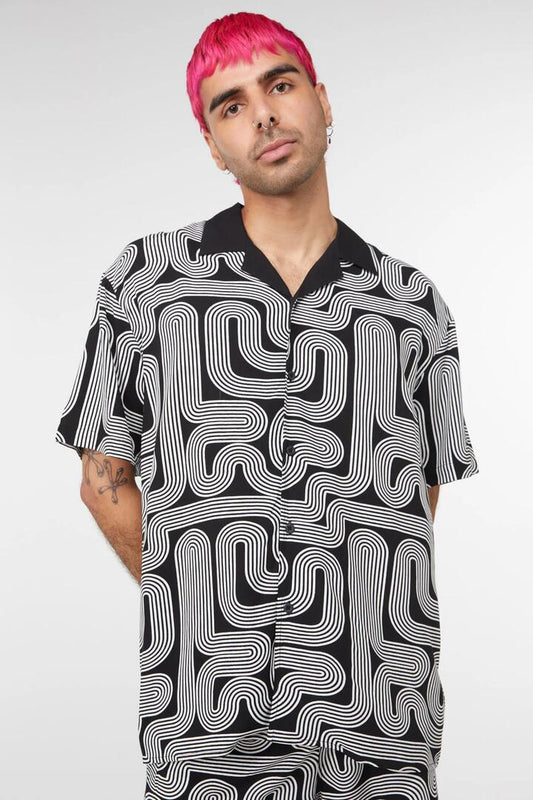 Image of a model wearing Tops. Productname: Geo Print Shirt in Black colour by brand - Dangerfield