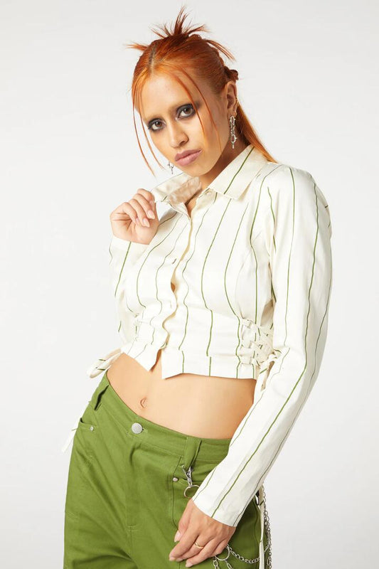 Image of a model wearing Tops. Productname: Impossible Things Lace Up Blouse in Cream colour by brand - Dangerfield