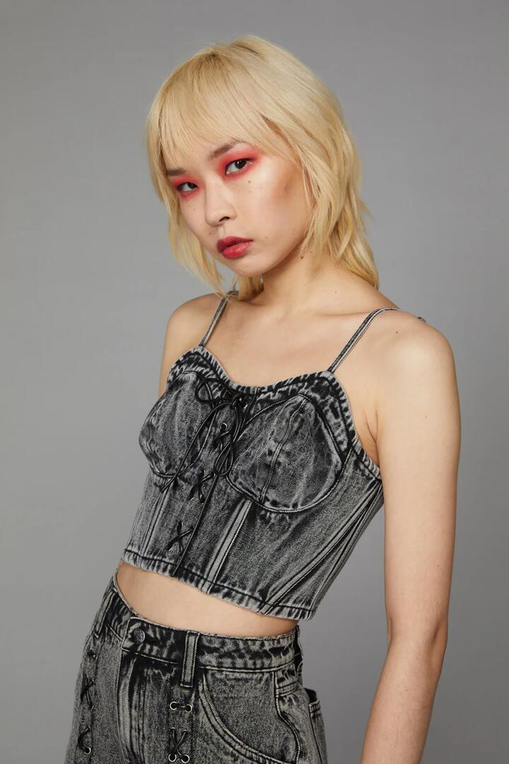 Image of a model wearing Tops. Productname: Acid Wash Lace Up Top in Acid Wash colour by brand - Black Friday