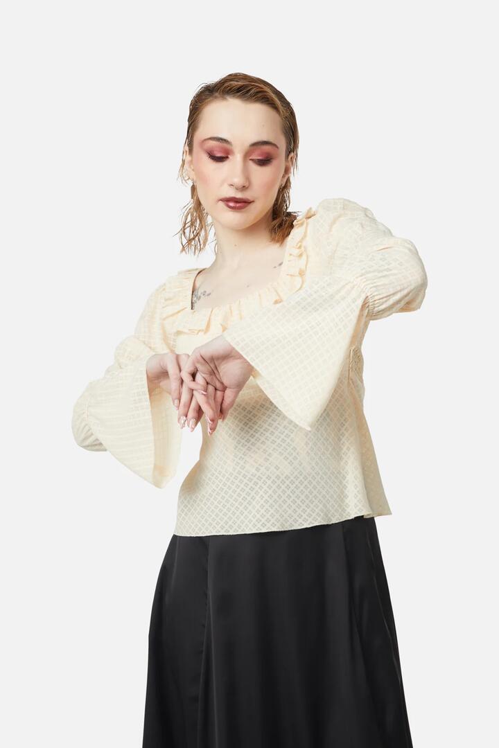 Image of a model wearing Tops. Productname: All Of White Sheer Blouse in Cream colour by brand - Dangerfield