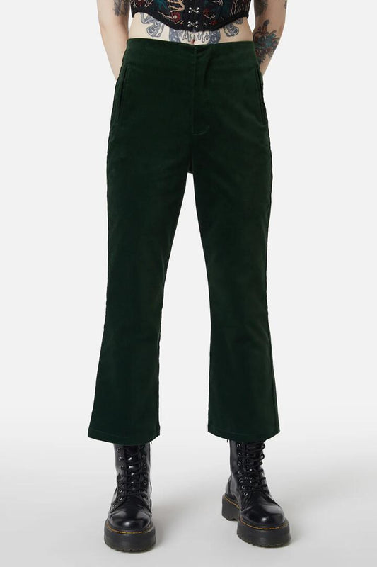 Image of a model wearing Pants. Productname: At The Alter Velvet Kick Flares in Emerald colour by brand - Dangerfield