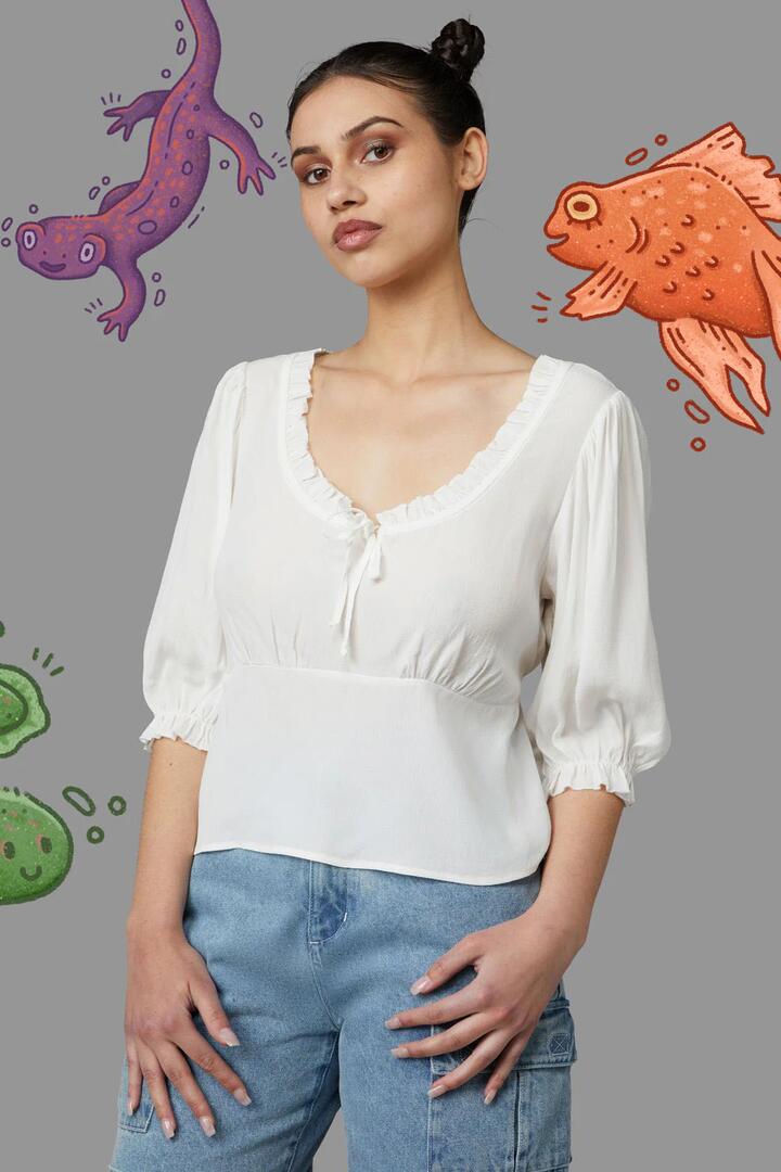 Image of a model wearing Tops. Productname: Lily Pad Blouse in Cream colour by brand - Black Friday