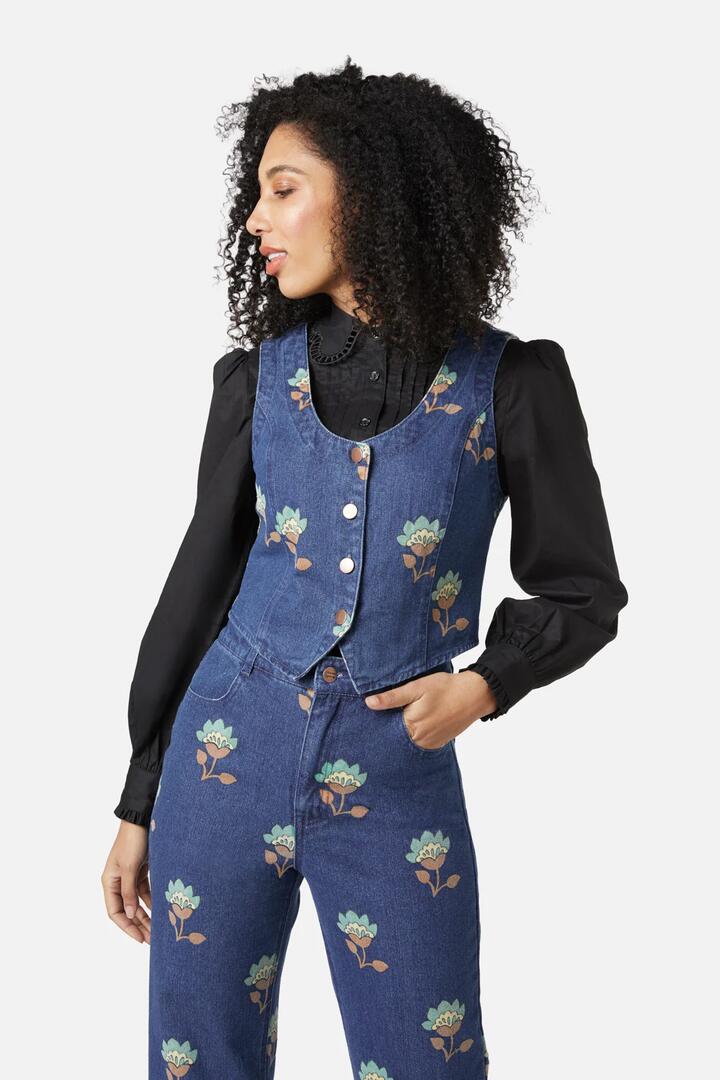 Image of a model wearing Tops. Productname: Retro Flora Vest in Dark Denim colour by brand - Princess Highway