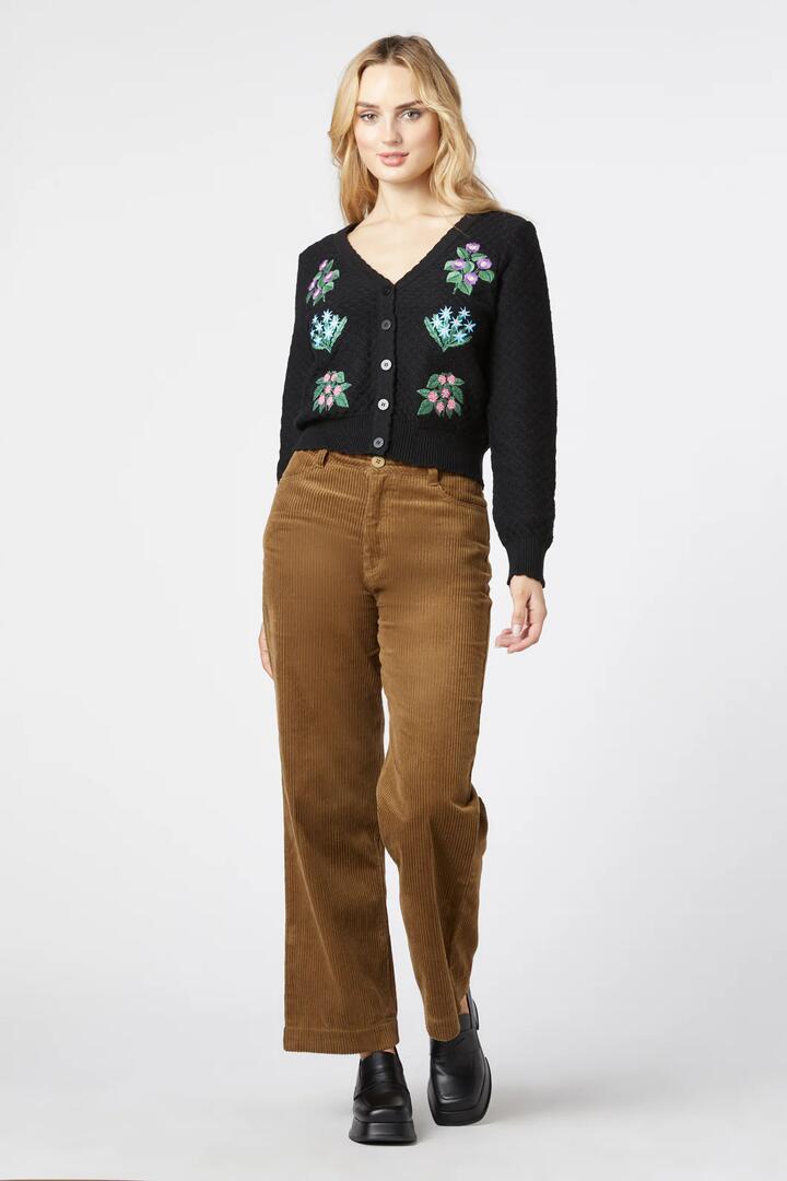 Image of a model wearing Pants. Productname: Jamie Cord Pant in Black colour by brand - Princess Highway