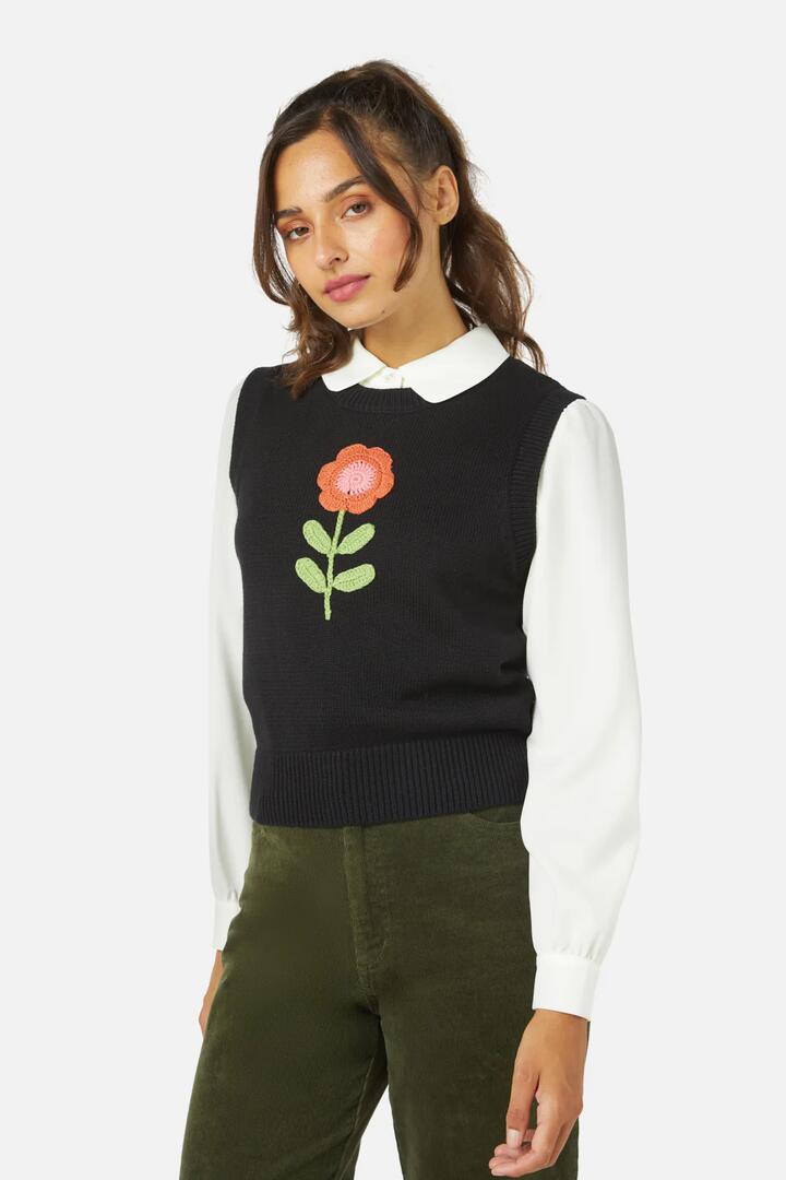 Image of a model wearing Tops. Productname: Belle Emb Knit Vest in Black colour by brand - Princess Highway