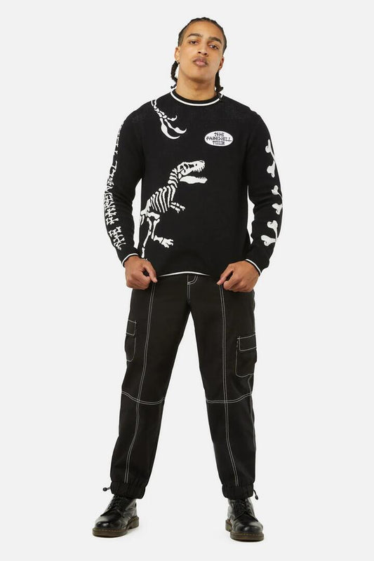 Image of a model wearing Outerwear. Productname: The Farewell Tour Badge Knit Jumper in Black colour by brand - Dangerfield