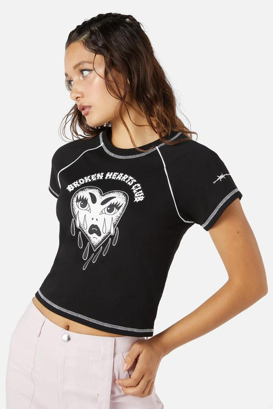 Image of a model wearing Tops. Productname: Broken Hearts Crop Raglan in Black colour by brand - Dangerfield