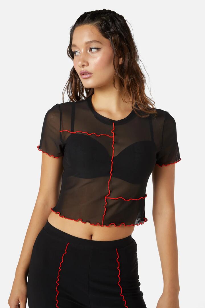 Image of a model wearing Tops. Productname: Manic Short Sleeve Babylock Mesh Top in Black/Red colour by brand - Dangerfield