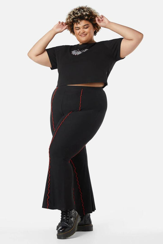 Image of a model wearing Pants. Productname: Curve Manic Mesh Babylock Pants in Black/Red colour by brand - Dangerfield