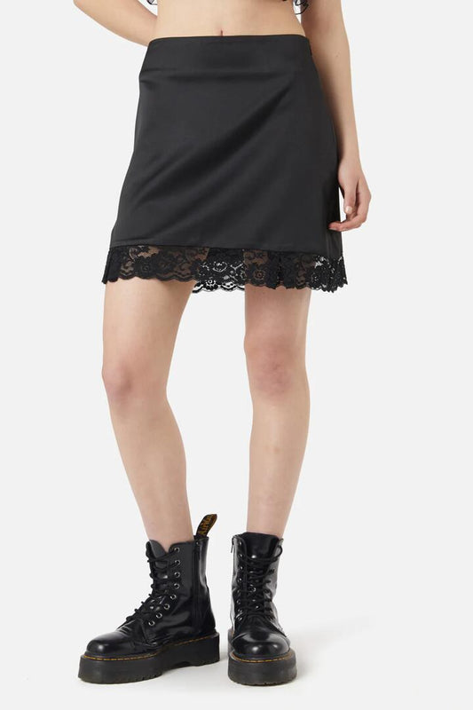 Image of a model wearing Skirts. Productname: Satin Lace Slip Mini Skirt in Black colour by brand - Dangerfield