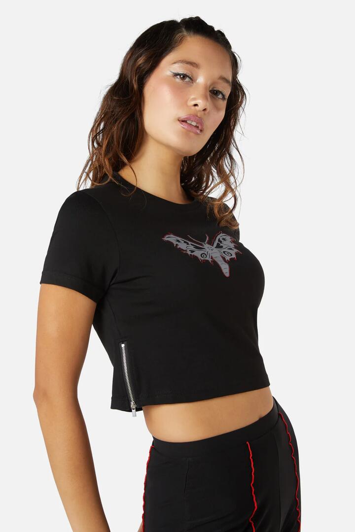 Image of a model wearing Tops. Productname: Diamante Butterfly Zipper Tee in Black colour by brand - Dangerfield