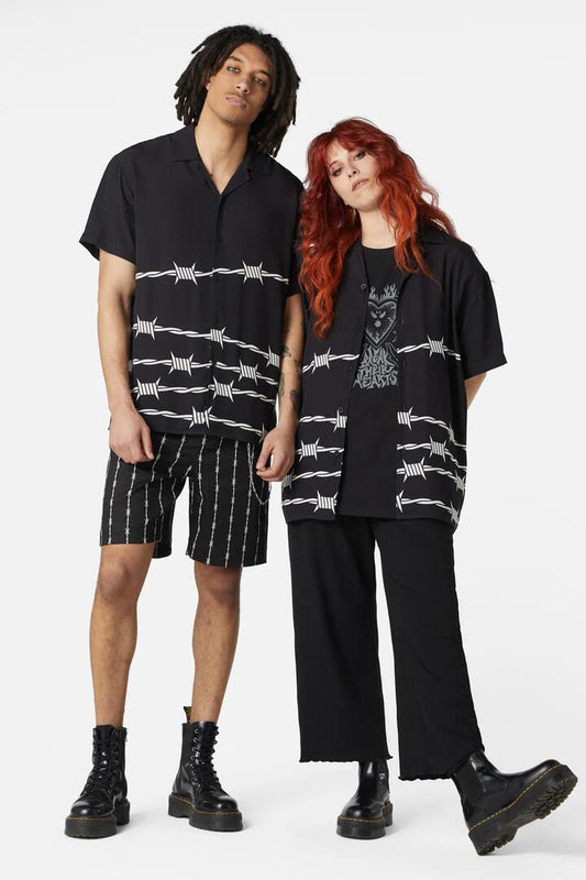 Image of a model wearing Tops. Productname: Barbed Wire Border SS Shirt in Black/White colour by brand - Dangerfield