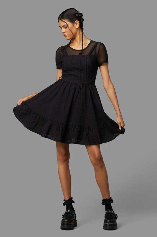 Image of a model wearing Dress. Productname: Jenna Pinafore in Black colour by brand - Black Friday