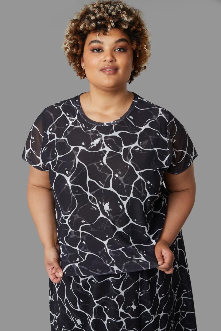 Image of a model wearing Tops. Productname: Curve Lily Pad Top in Black colour by brand - Black Friday