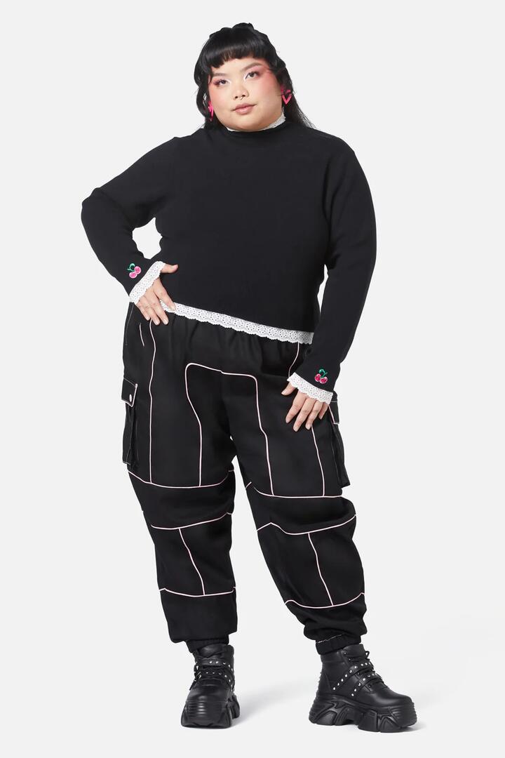 Image of a model wearing Tops. Productname: Curve Super Psycho Knit Top in Black colour by brand - Black Friday